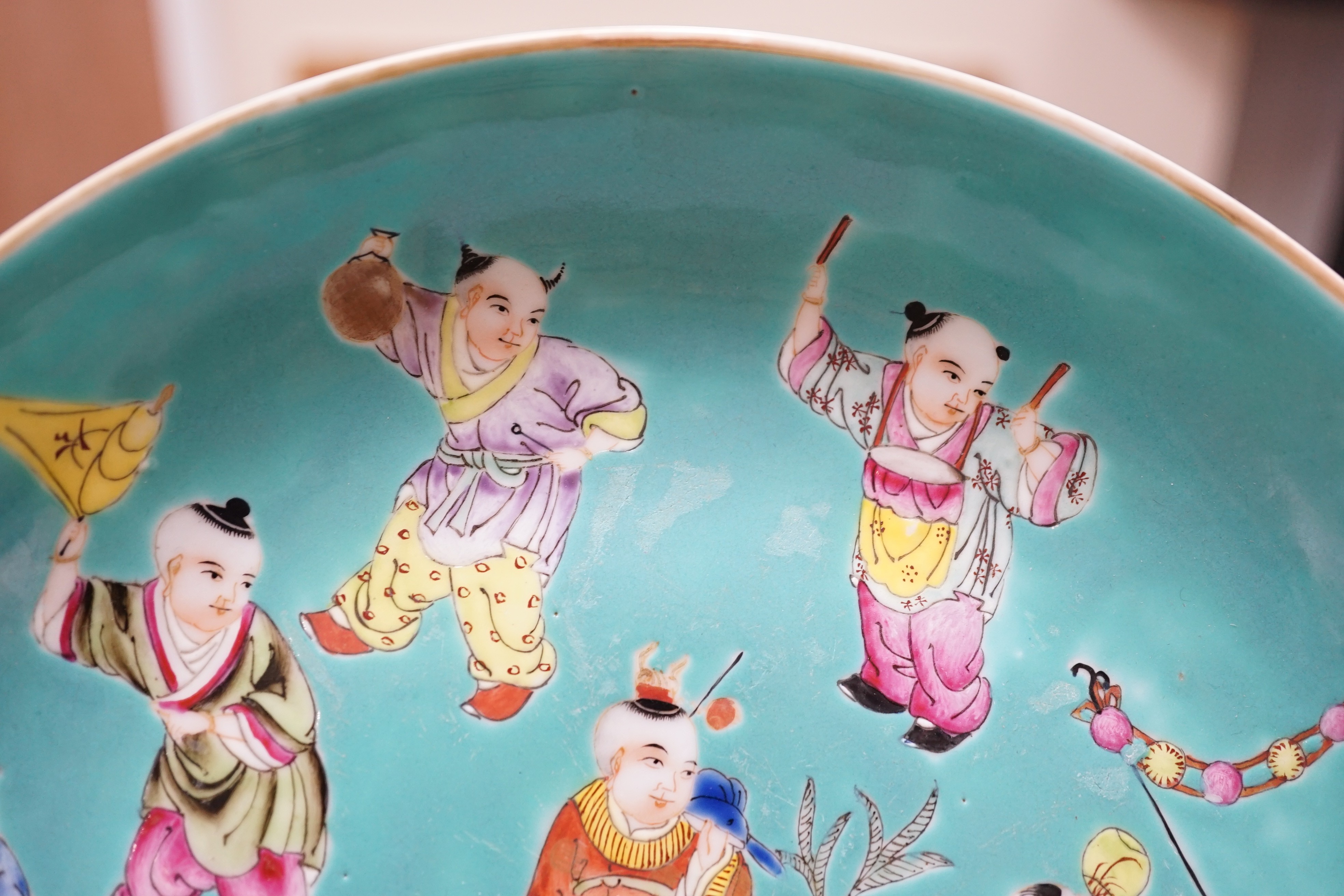 A Chinese turquoise ground 'Boys' dish, Jiaqing seal mark but Republic period, 23.5cm diameter, two hairline cracks